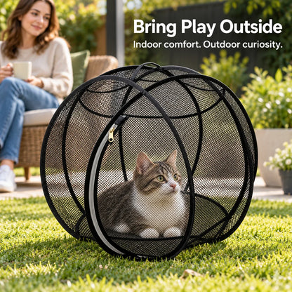 Black mesh cat enclosure on level backyard grass with an owner nearby.